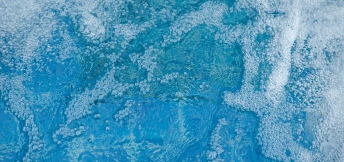 small bubbles in a swimming pool from the return jets